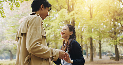 Buy stock photo Smile, dance and holding hands with Japanese couple in park for romance, bonding and relationship. Support, care and happiness with man and woman in Japan nature for date, commitment and peace