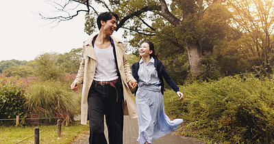 Buy stock photo Love, running and holding hands with Japanese couple in park for romance, bonding and fun. Support, care and happiness with man and woman in Japan nature for date, freedom and peace together