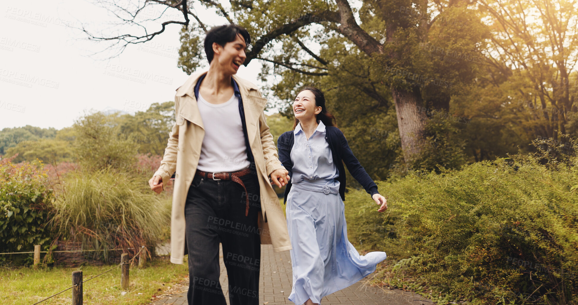 Buy stock photo Love, running and holding hands with Japanese couple in park for romance, bonding and fun. Support, care and happiness with man and woman in Japan nature for date, freedom and peace together