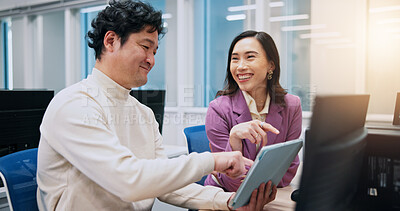 Buy stock photo Collaboration, pointing and tablet with business people in office for creative, design or web development. Feedback, laughing or funny with Japanese man and woman in workplace for discussion