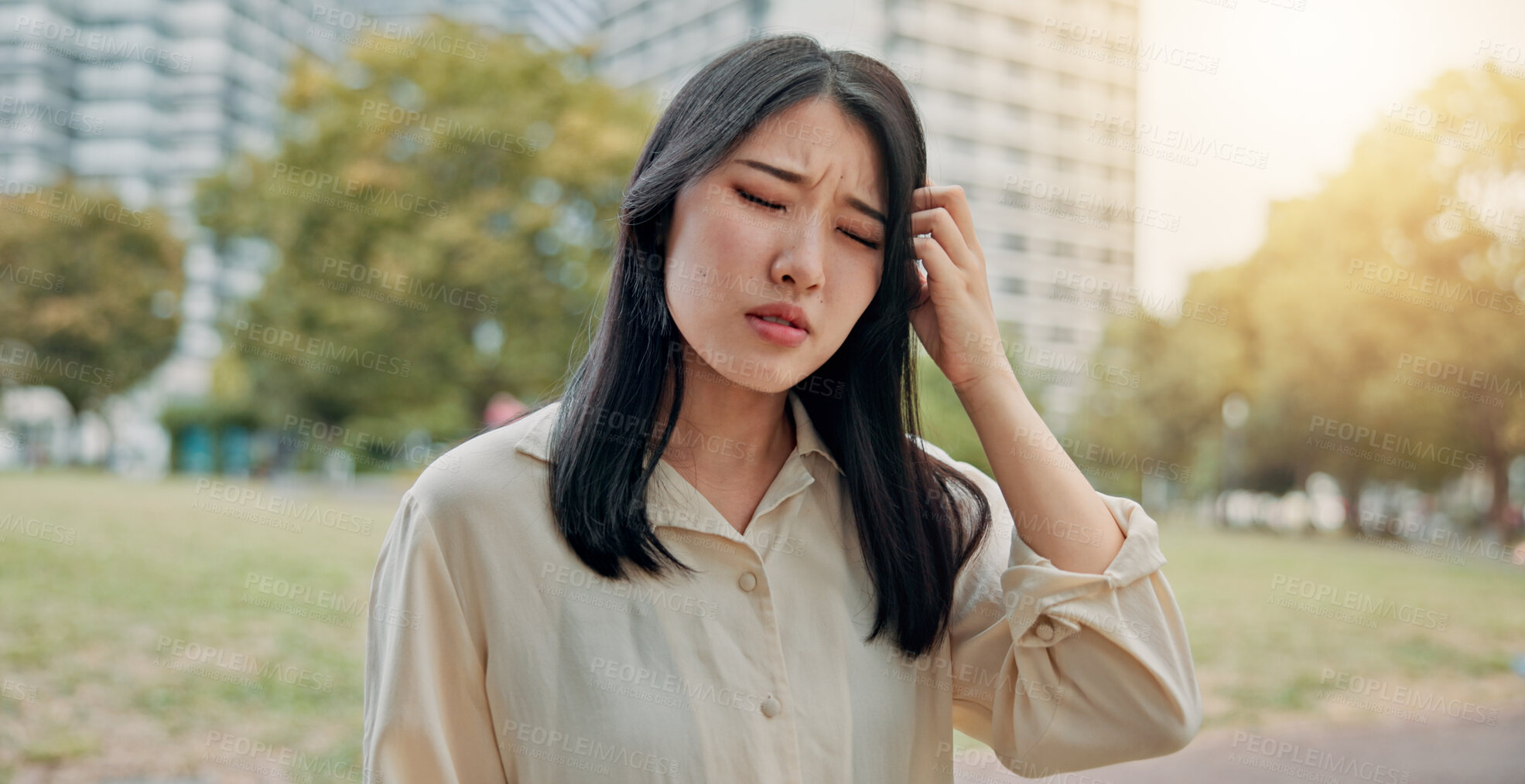 Buy stock photo Frustrated, asian woman and headache with stress in city for strain, pressure or discomfort at outdoor park. Japan, female person or migraine with pain, ache or vertigo for dizziness in an urban town