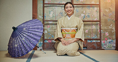 Buy stock photo Kimono, portrait and umbrella with Japanese woman on floor of Okiya for traditional culture or fashion. Heritage, kneeling and smile of confident asian person in outfit for hospitality or service 
