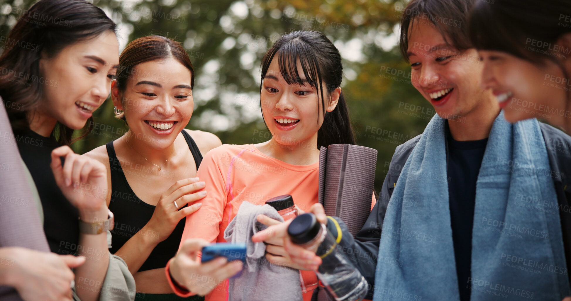 Buy stock photo Yoga, pointing and people with smartphone, fitness and research for poses, guide or video with instruction. Outdoor, morning and group with mobile for routine, joy and social media with tips in Japan