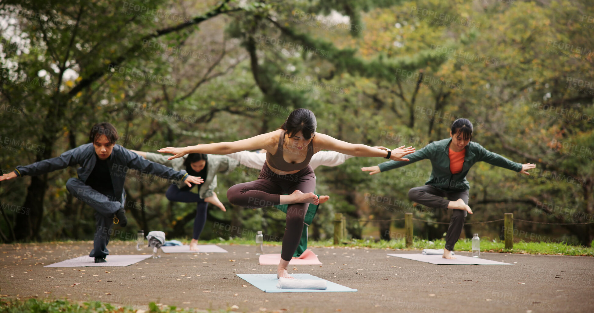 Buy stock photo People, outdoor nature and balance at yoga class, meditation and support for spiritual wellness. Forest, holistic healing and instructor for fitness in Japan, friends group and pilates mindfulness