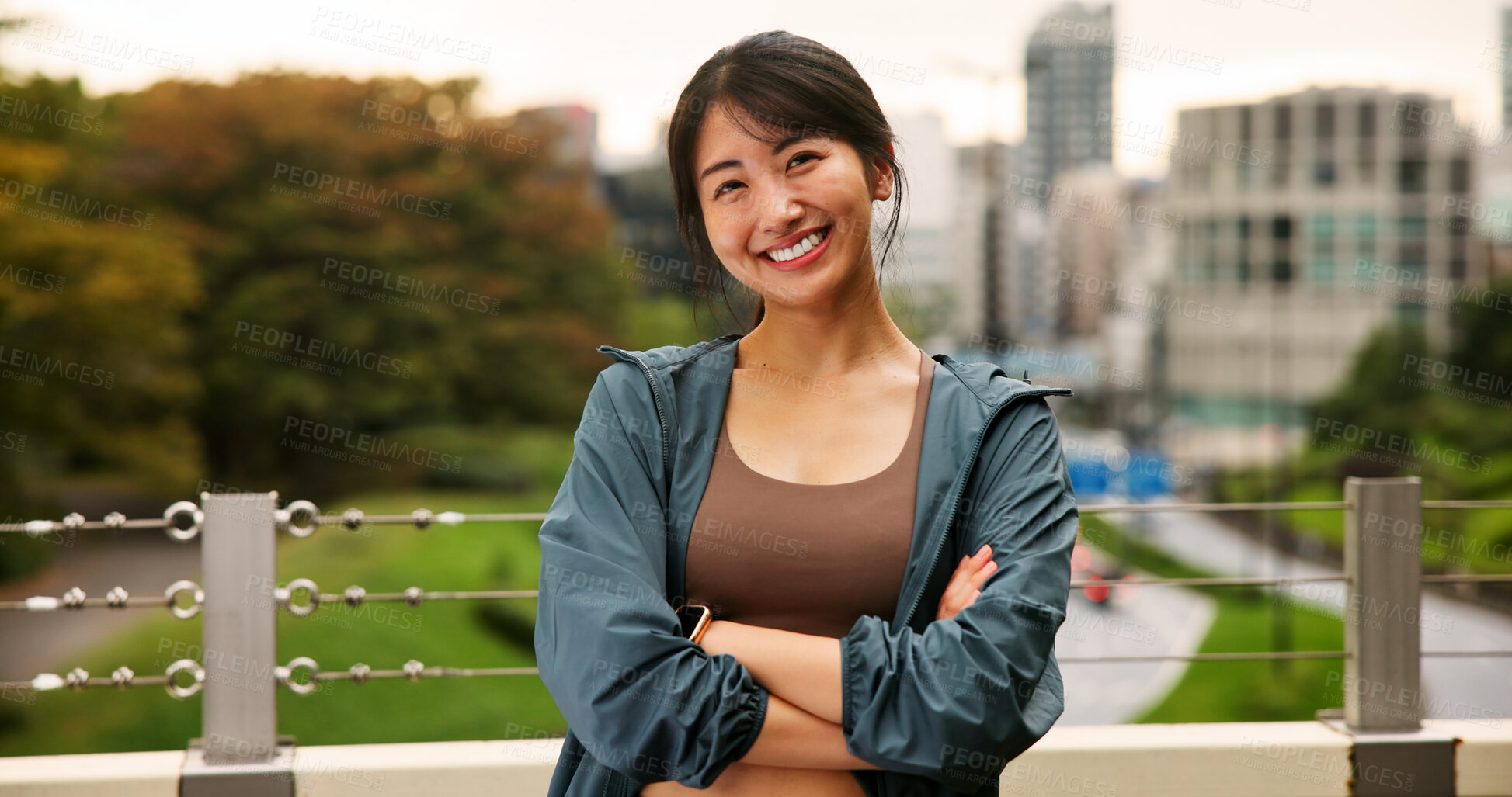 Buy stock photo Arms crossed, exercise and portrait of woman in city for cardio or marathon training routine. Bridge, fitness and smile of happy Japanese sports athlete or runner outdoor for health or wellness