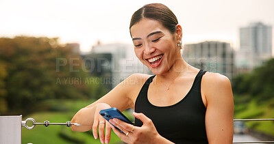 Buy stock photo Phone, fitness and woman in city with online exercise plan for running, wellness and training. Happy, sports and Japanese female athlete on cellphone with mobile health tracker app for cardio workout