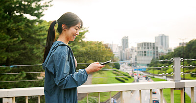 Buy stock photo Happy, asian woman or walking with phone on bridge for workout app, fitness or tracker in city. Japan, female person or runner with smile on mobile smartphone for healthy performance in an urban town