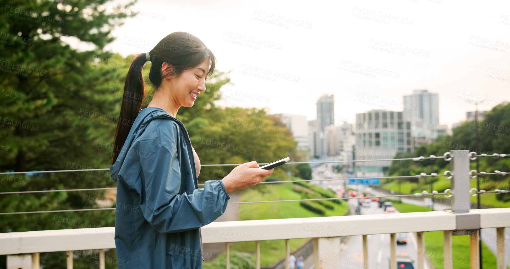 Buy stock photo Happy, asian woman or walking with phone on bridge for workout app, fitness or tracker in city. Japan, female person or runner with smile on mobile smartphone for healthy performance in an urban town