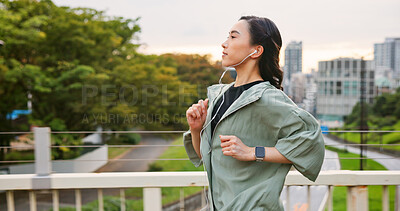 Buy stock photo Japanese woman, running and earphones in city of sport exercise, marathon training and listen to music. Female athlete, cardio and workout practice of endurance performance, wellness and Japan bridge