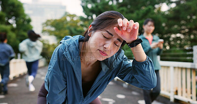 Buy stock photo Fatigue, break and woman outdoor with running for health, wellness and marathon training in city. Tired, sweating and Japanese female athlete with exhaustion for cardio exercise or workout in town.