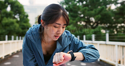 Buy stock photo Fitness, smart watch and Asian woman at park to check training results or track performance on break. Sports, workout and Japanese person with wristwatch, time app and monitor pulse for body wellness