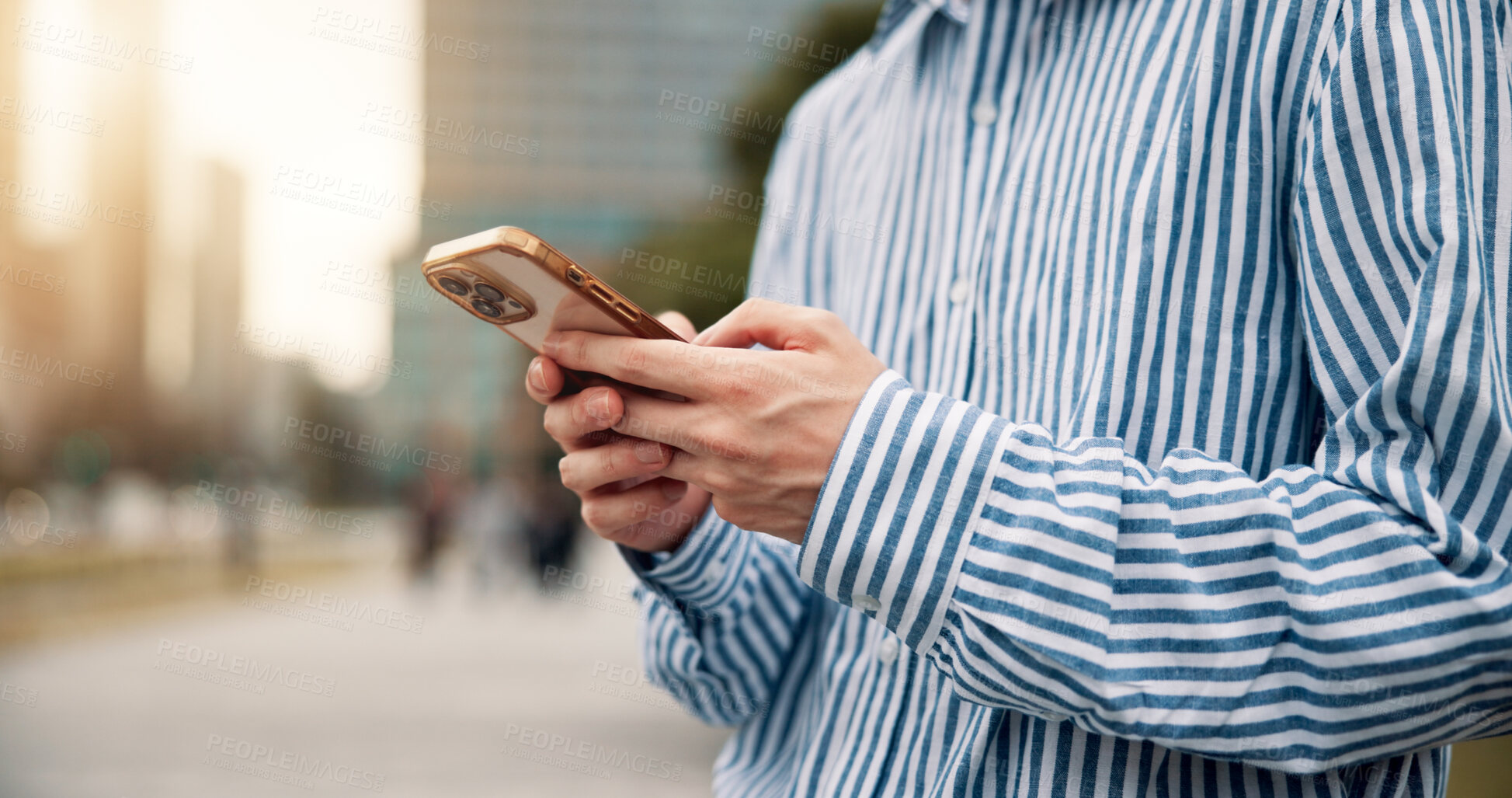 Buy stock photo Man, hands and phone in city for business, connectivity and schedule update in Japan. Person, mobile and typing in urban Tokyo for networking, email response and communication on morning commute