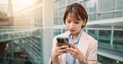 Buy stock photo Phone, typing and businesswoman in office for email, communication or networking online. Cellphone, contact and Japanese female financial advisor reading finance investment report for revenue.