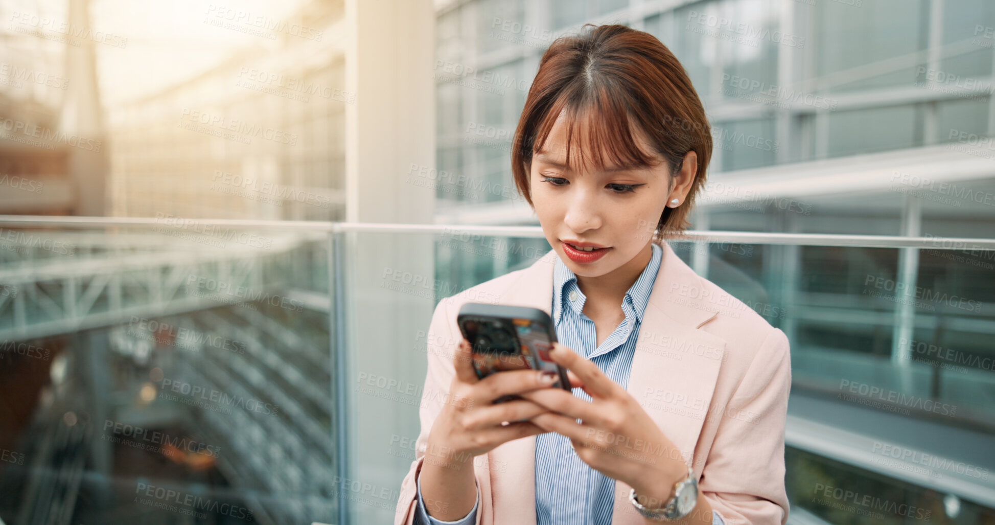 Buy stock photo Phone, typing and businesswoman in office for email, communication or networking online. Cellphone, contact and Japanese female financial advisor reading finance investment report for revenue.