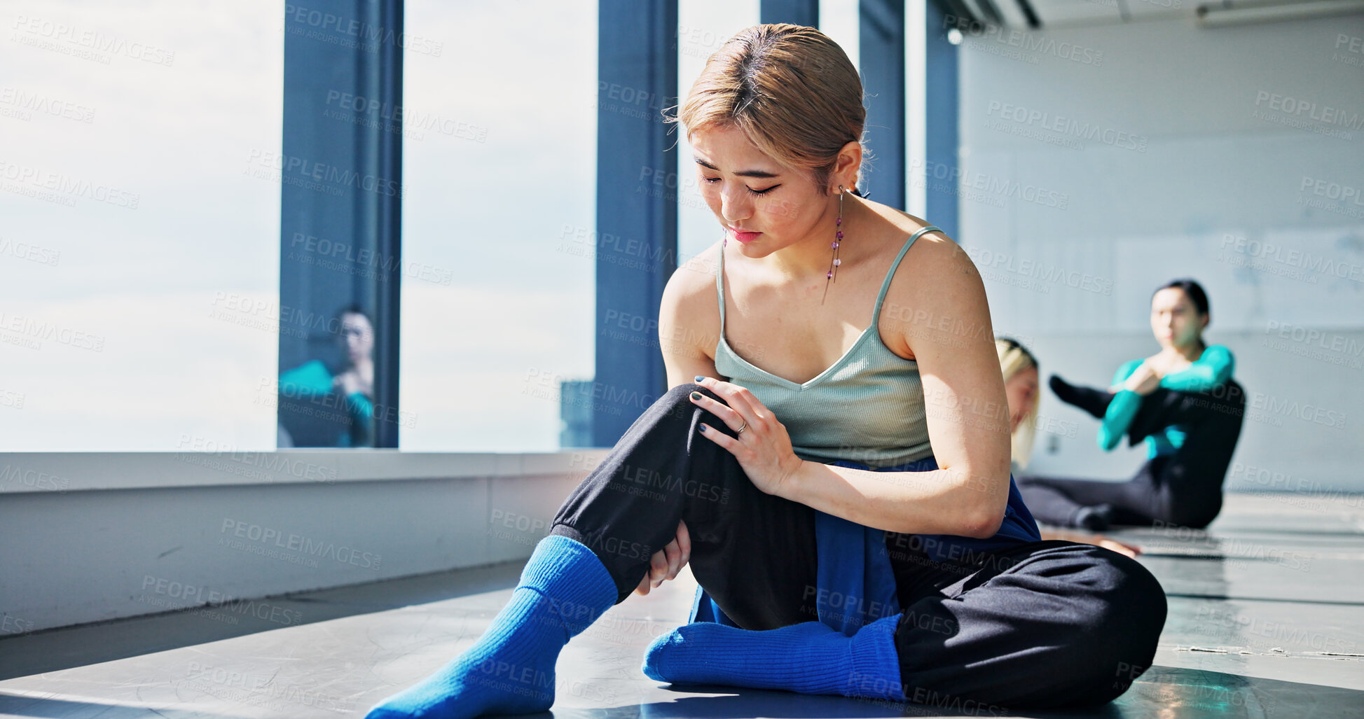 Buy stock photo Injury, knee and woman in studio, hurt and fracture of muscle, joint pain and accident for person. Tension, worry and thinking of performance, fitness and inflammation for performer, sore and Japan