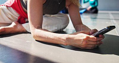 Buy stock photo Phone, stretch and dancer typing in studio for networking, communication or contact with app. Hands, warm up exercise and person preparing for rehearsal or practice with cellphone for online routine.