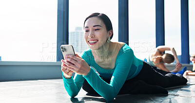 Buy stock photo Dancer, break and woman with smartphone in class, browsing social media and laughing or watching video. Japanese, influencer and communication with online, audience and performer for live stream