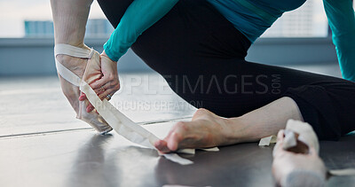 Buy stock photo Stretching, legs and dancer in studio, hands and warm up for ballet, healthy and preparing for performance. Fitness, wellness and balance for ballerina, person and training of feet, flexible or Japan