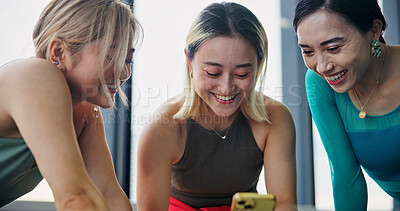 Buy stock photo Phone, friends and women in dance studio with networking, communication or browsing social media. Smile, cellphone and Japanese ballerinas watching online video for classic technique at rehearsal.