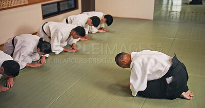 Buy stock photo Bow, honor and people in martial arts studio for practice, training or self defense class. Culture, karate and group of students with respect or etiquette gesture to master in dojo for greeting.