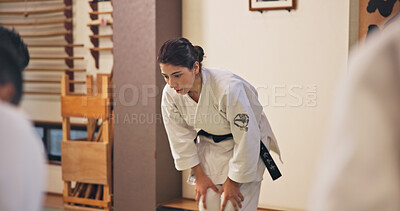 Buy stock photo Martial arts, woman and bow with respect in dojo for honor, self defense training and discipline in class. Japanese culture, aikido and person with traditional greeting for etiquette and gratitude