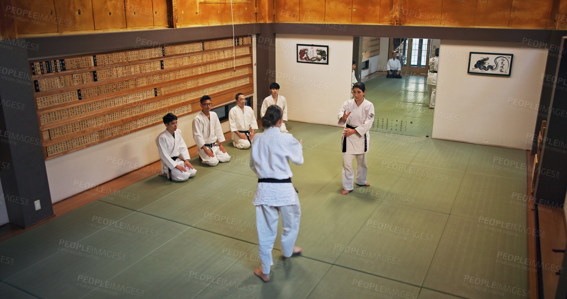 Buy stock photo Martial arts, demonstration and Japanese people with learning, exercise and karate etiquette in dojo. Japan, training and fight studio with sport, discipline and warrior in taekwondo class in gym