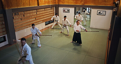 Buy stock photo Dojo, group class and Aikido training with wood sword Japanese martial arts and fight exercise in wellness studio. Learning, master and bamboo weapon with people and strike practice for defence