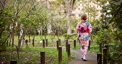 Buy stock photo Back, Kimono and travel with woman in park to explore green location for sightseeing or tourism. Fashion, nature conservation and walking with person outdoor in Japan for culture, holiday or vacation