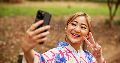 Buy stock photo Selfie, smile and woman in nature, peace sign and happy for memory on vacation, travel and kimono. Outdoor, photography and gesture for profile picture, digital and photo for social media in Japan