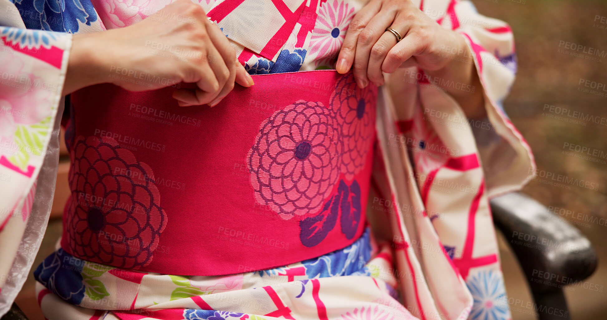 Buy stock photo Woman, hands and kimono with belt for fashion, traditional style and indigenous textile in Japan. Closeup, girl waist and fabric in Tokyo park with culture, heritage and elegant aesthetic on bench