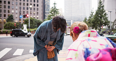 Buy stock photo Bow, respect and man in city for welcome, greeting and tradition with kimono. Japanese people, farewell and urban Tokyo street with heritage custom and cultural robe in town for vacation departure