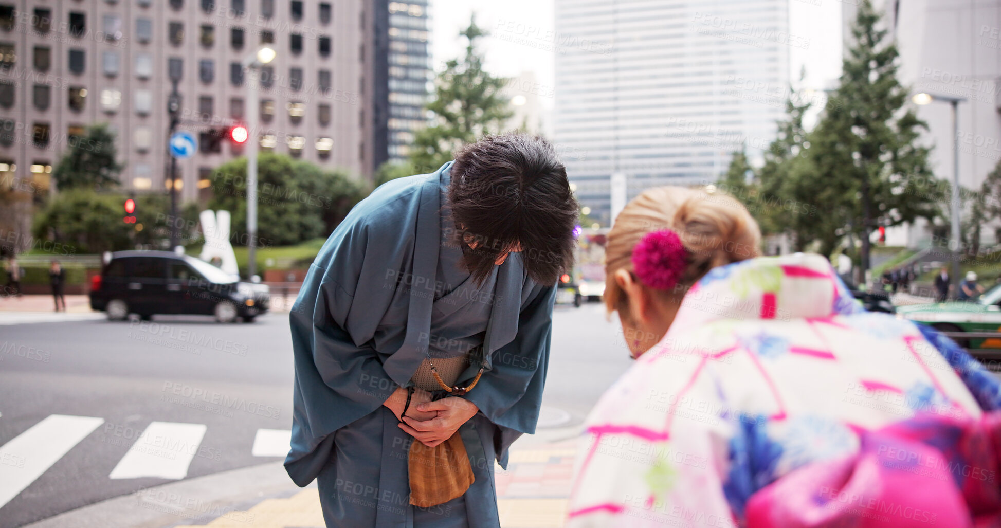 Buy stock photo Bow, respect and man in city for welcome, greeting and tradition with kimono. Japanese people, farewell and urban Tokyo street with heritage custom and cultural robe in town for vacation departure