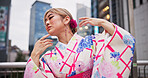 Japanese woman, artist and dance with kimono in city for hand movement, contemporary style and expression. Creative culture, performer and nihon buyo with traditional fashion, urban town or heritage