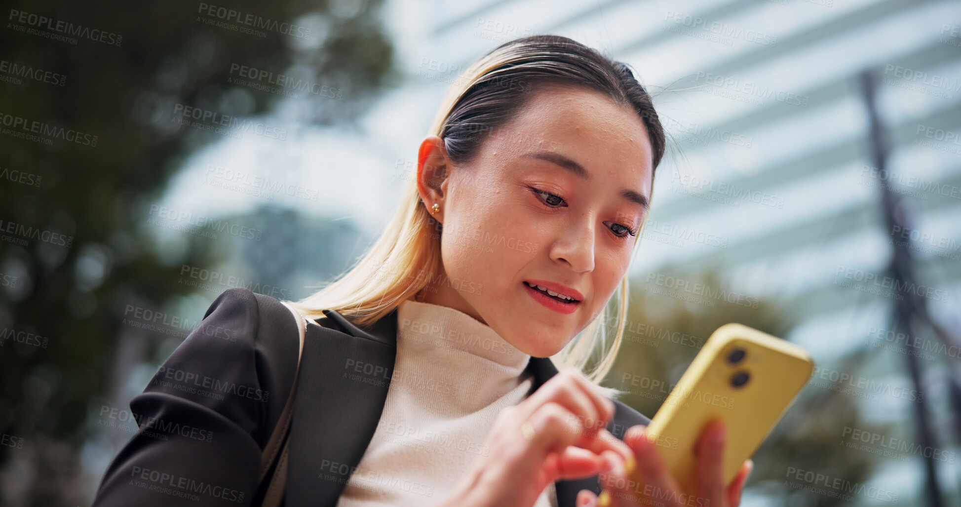 Buy stock photo Business woman, texting and phone in city with contact, reading and networking for legal career in street. Person, happy and corporate lawyer with smartphone for notification, deal or travel in Japan
