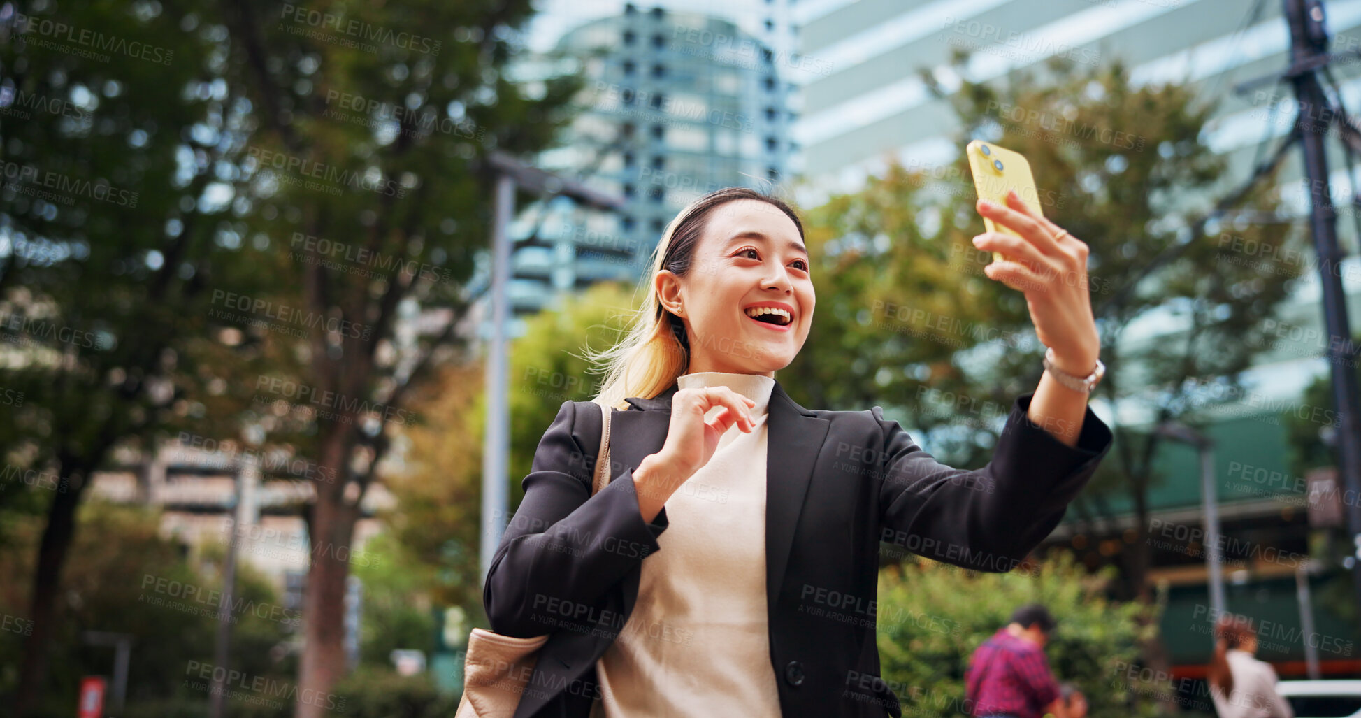 Buy stock photo Business woman, video call and phone in city with smile, contact and networking with legal career in street. Person, happy and corporate lawyer with smartphone for good news, deal or travel in Japan