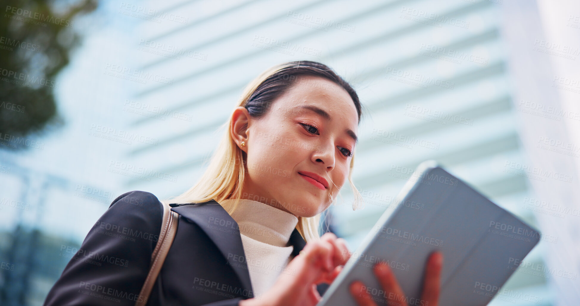 Buy stock photo Tablet, city and Japanese woman with business commute, morning and tech of lawyer below. Online, digital and booking from on app for urban travel to work with website, internet and trip in Tokyo