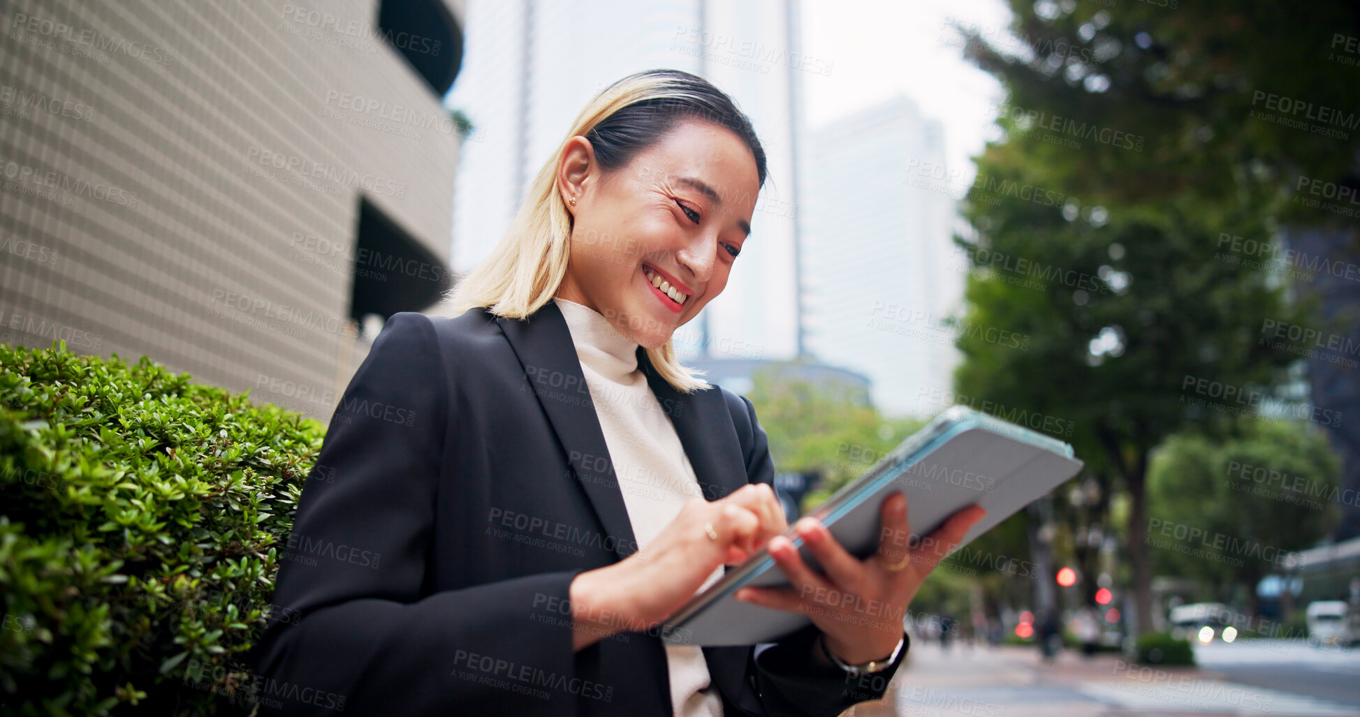 Buy stock photo Tablet, city and happy Japanese woman with business commute, morning and tech of lawyer below. Online, digital and booking on transport app for travel to work with website, internet and trip in Tokyo