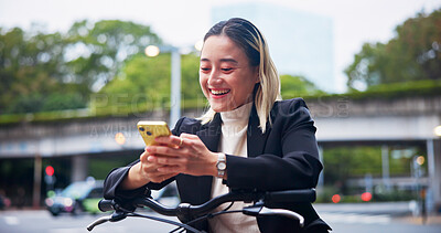 Buy stock photo Phone, bicycle and business woman laugh at meme, gif and cycling on commute to work in Japan. Mobile, bike and happy worker in city to travel on sustainable transport, text or reading on social media