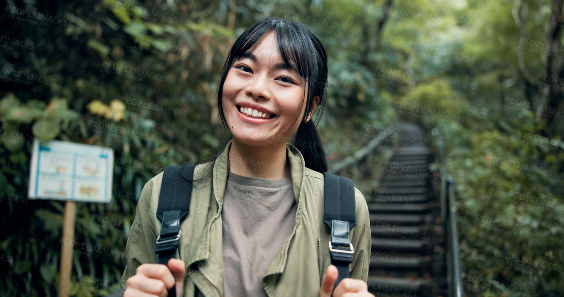 Buy stock photo Smile, nature and portrait of woman hiking on adventure, vacation or weekend trip outdoor. Happy, journey and Japanese female person trekking in forest, environment or woods for holiday activity.