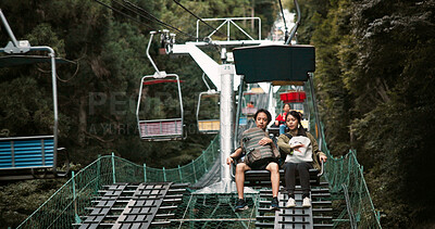 Buy stock photo Mountain, travel and couple on chair lift for romantic date, bonding or outdoor adventure together on Mount Takao. Holiday, Japanese man and woman on cable ride in park with love, nature and vacation