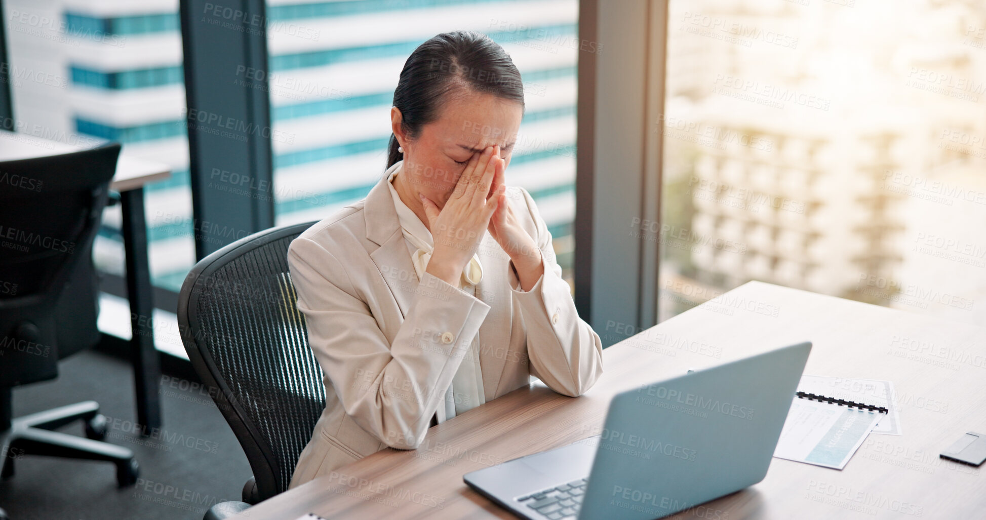 Buy stock photo Japan, laptop and woman at desk, headache and burnout with deadline, stress and overworked. Asian person, employee and accountant in office, computer and migraine with pain, deadline and pressure