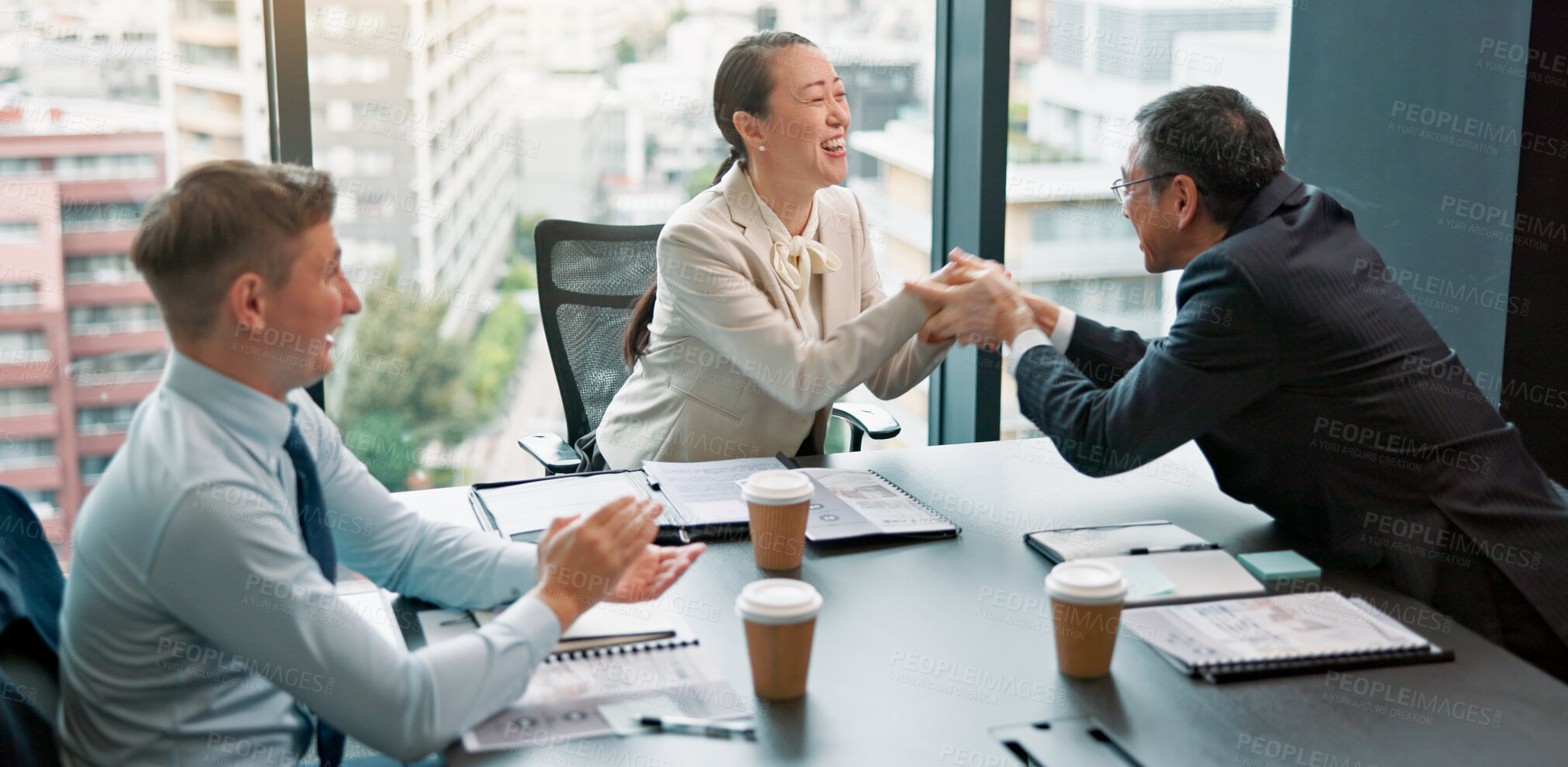 Buy stock photo Handshake, client and people in boardroom, celebration and negotiation for business deal and talking. Office, shaking hands and group with paperwork for proposal, excited and sales manager in Japan