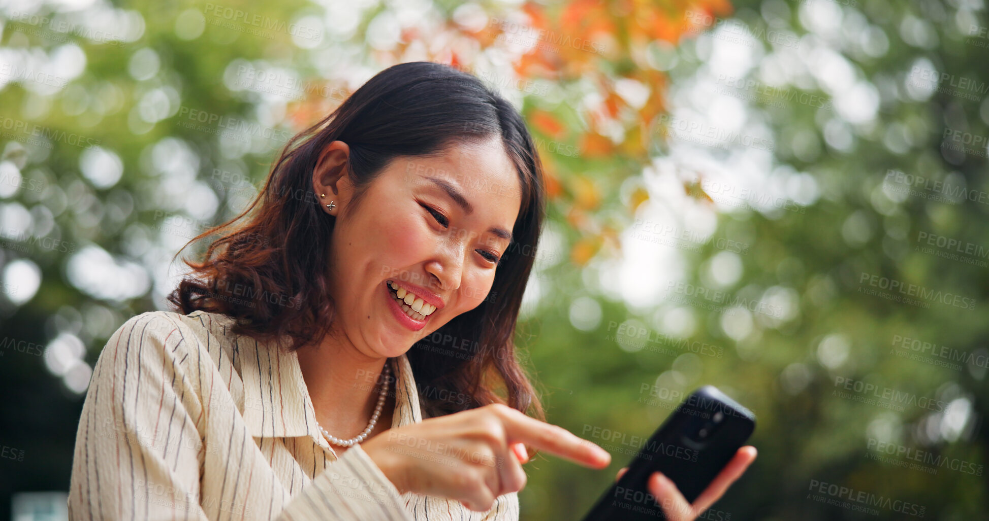Buy stock photo Woman, happy and outdoor with phone for social media, good news and online shopping deal in Tokyo. Japanese girl, mobile and smile in park for ecommerce promotion, app notification and connectivity