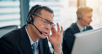 Buy stock photo Office, computer and businessman with headache for call center, muscle tension and stress for deadline. Career, employees and mature agent with migraine for headset noise, pain or consulting in Japan