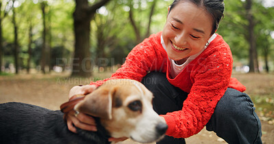 Buy stock photo Nature, happy and woman with dog in forest for bonding, companion and love for adoption. Smile, connection and Japanese female person with beagle puppy for pet outdoor in woods for playing together.