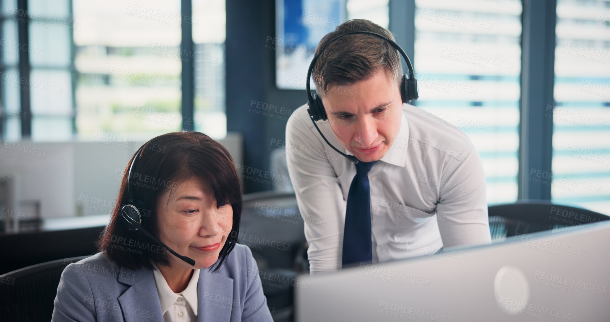 Buy stock photo People, employees and computer as call center agents on training for customer service, help and support in Japan. Business, mature woman and man at office with teaching or assist for software updates