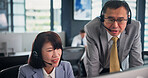 Business, employees and computer as call center agents on training for customer service, help or support in Japan. People, mature woman and man at office with teaching or assistance for telemarketing