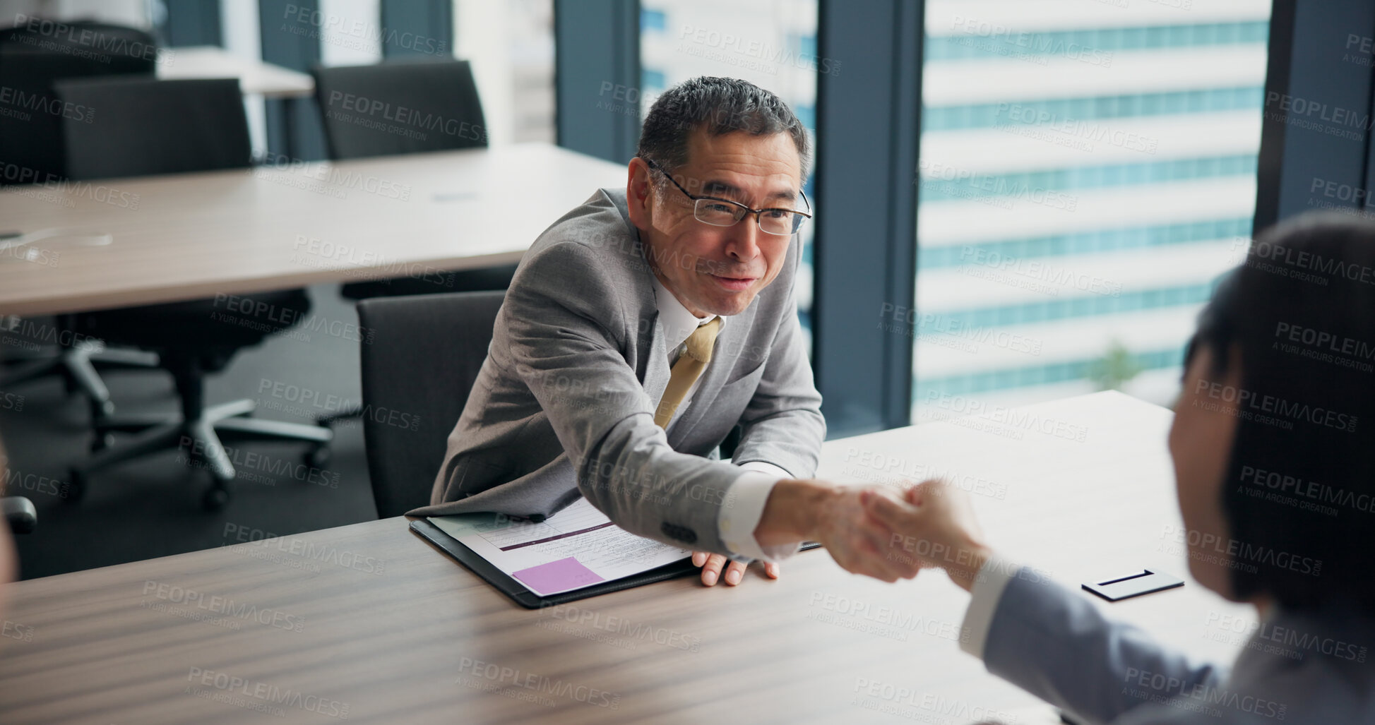 Buy stock photo Asian, business people and handshake with meeting for interview, contract or partnership at office. Japan, employees or colleagues shaking hands for hiring, recruiting or job opportunity at workplace