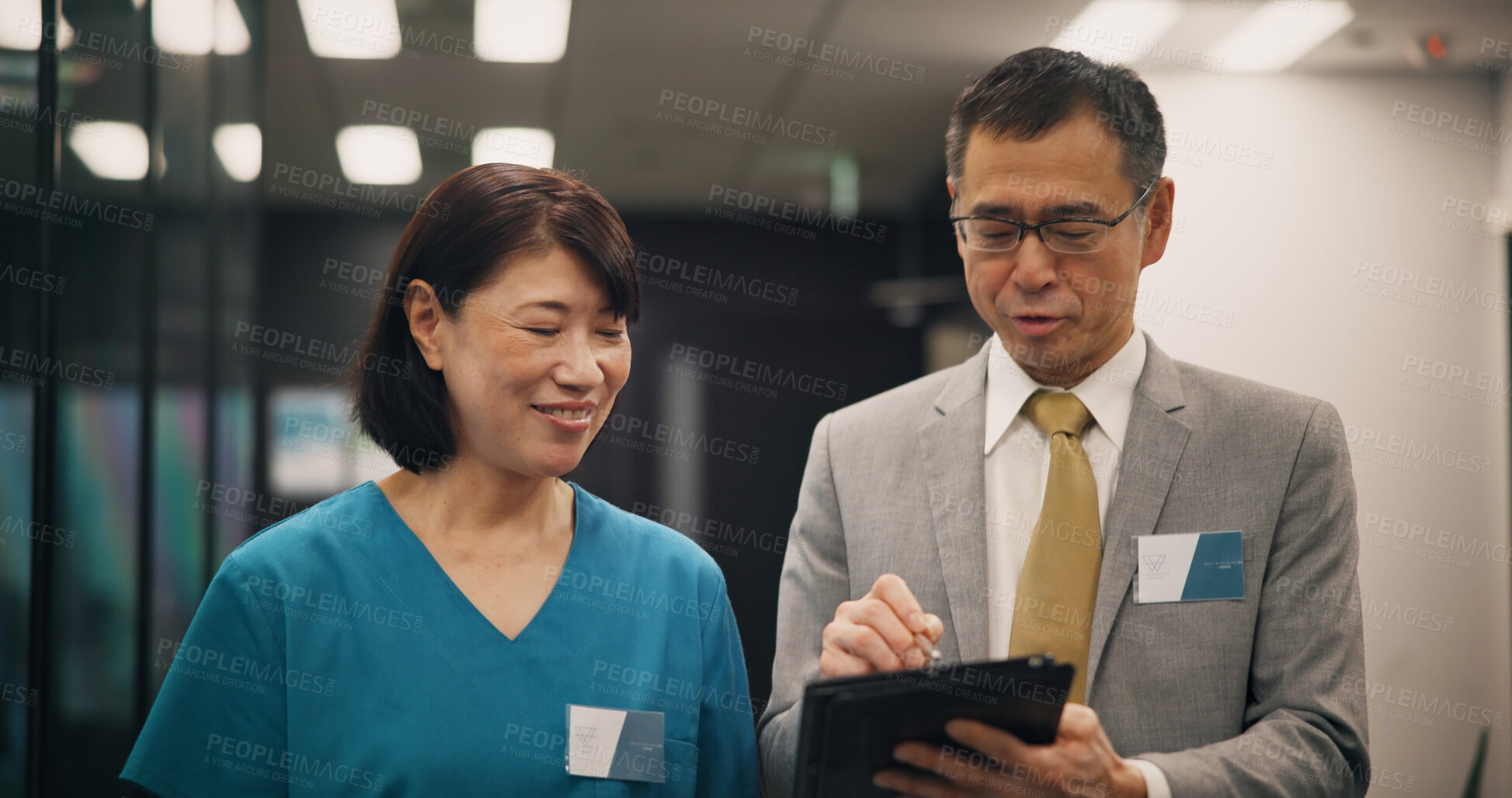 Buy stock photo Tablet, doctors and investor with Japanese man in hospital for planning, clinic research and healthcare study. Medical, feedback and teamwork with people and review for vaccine trial and consulting