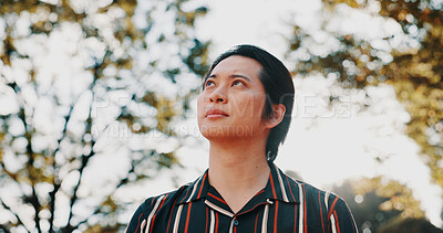Buy stock photo Morning, thinking and Asian man in park for wellness, ideas and relax with reflection, nostalgia and inspiration. Walking, nature and person outdoors for fresh air, peaceful mindset and calm in Japan